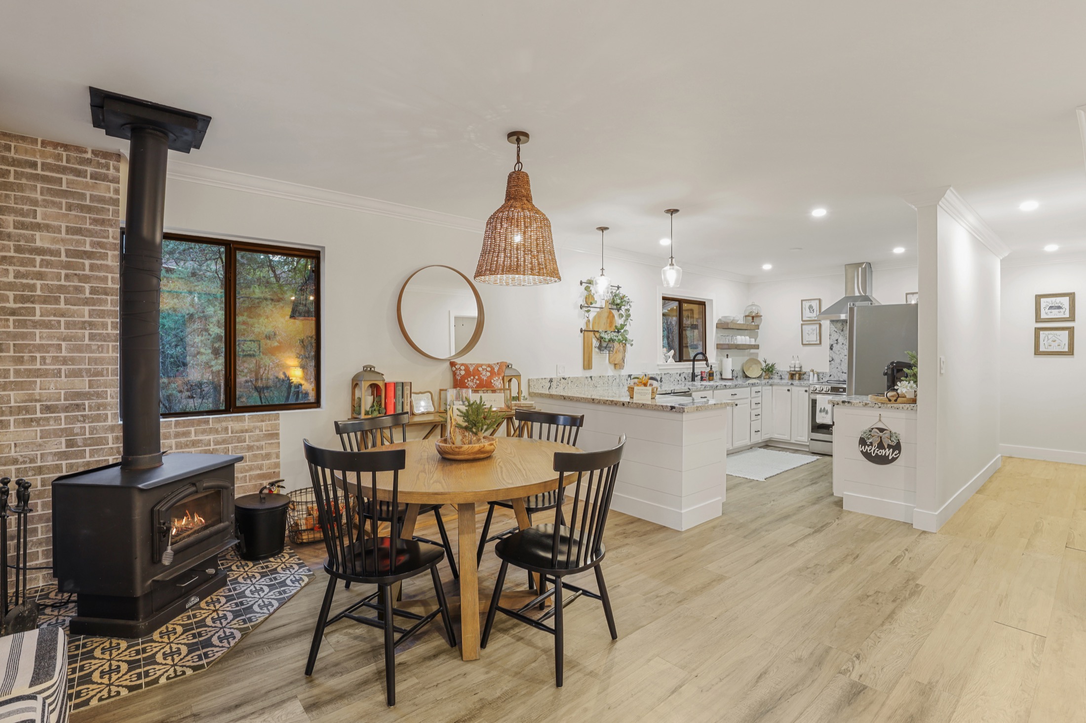 Kitchen and dining area beside the wood stove at Serenity Pines Hideaway